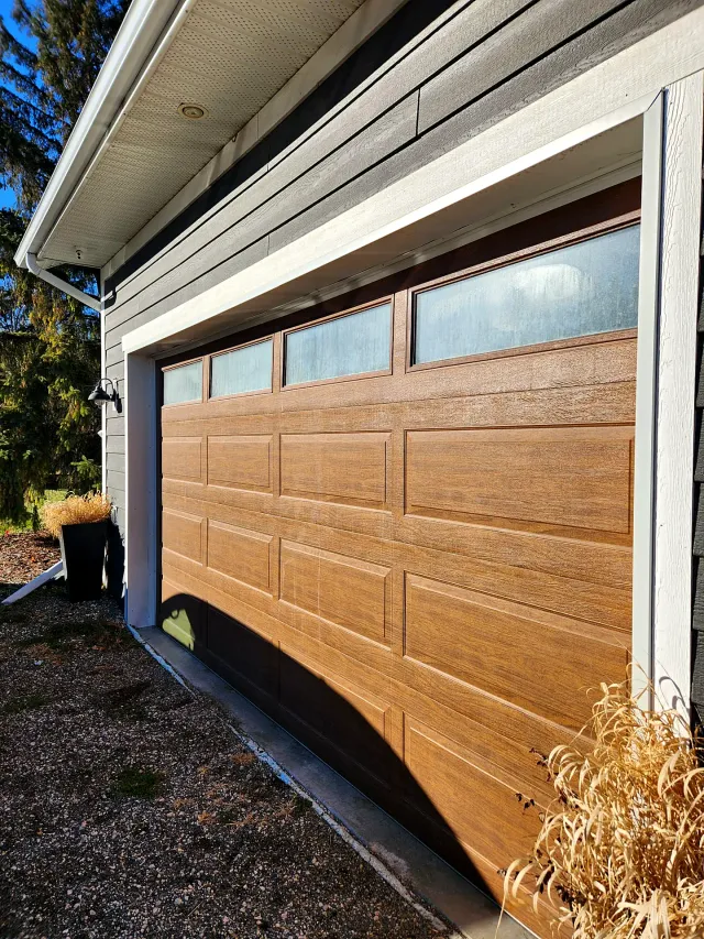 Garage door windows on a home before cleaning