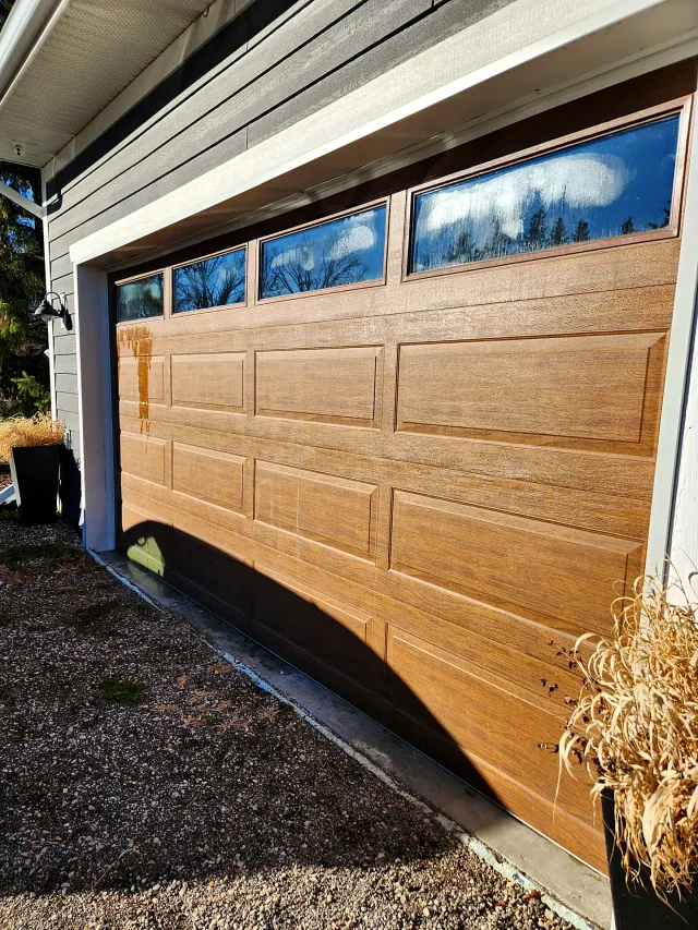Garage door windows on a home after cleaning