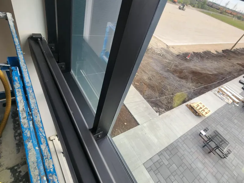 Window frame and sill inside a new commercial building, dark and free of dust