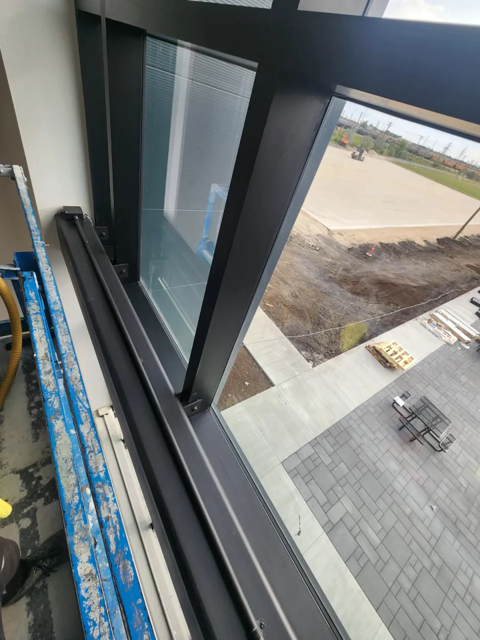 Window frame and sill inside a new commercial building, dark and free of dust